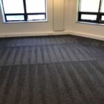 This is a photo of a grey office carpet that has just been professionally steam cleaned works carried out by Worcester Park Carpet Cleaning