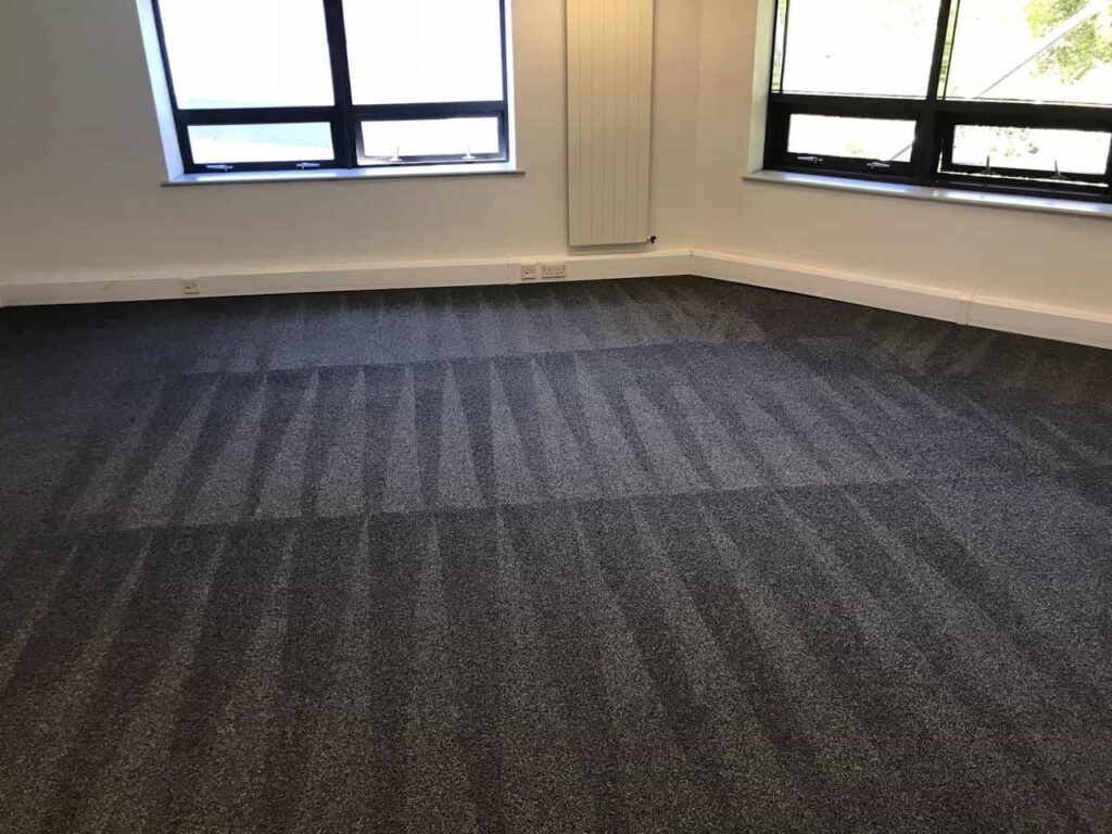 This is a photo of a grey office carpet that has just been professionally steam cleaned works carried out by Worcester Park Carpet Cleaning